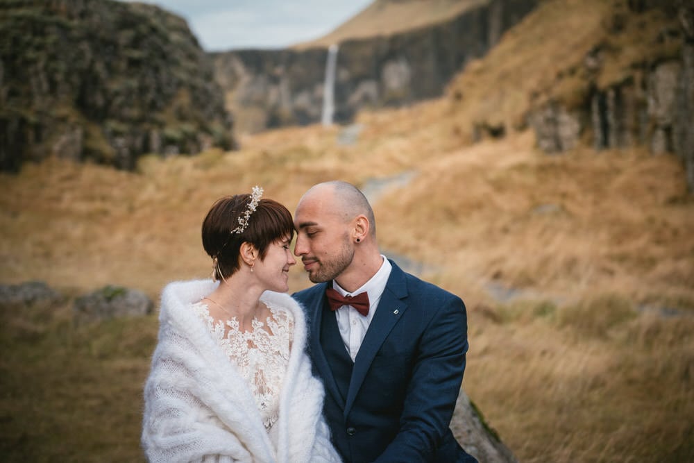 Iceland elopement example - couple photos by a waterfall