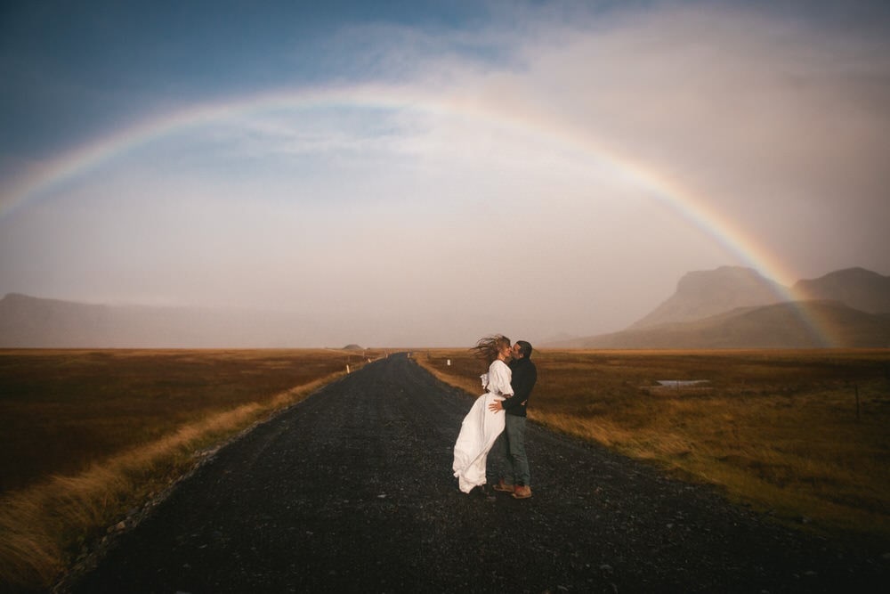 Iceland elopement example - couple photos with a rainbow