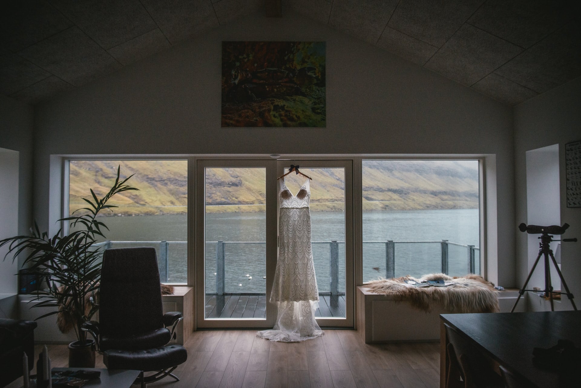 Wedding dress hanging on a door frame in the Faroe Islands