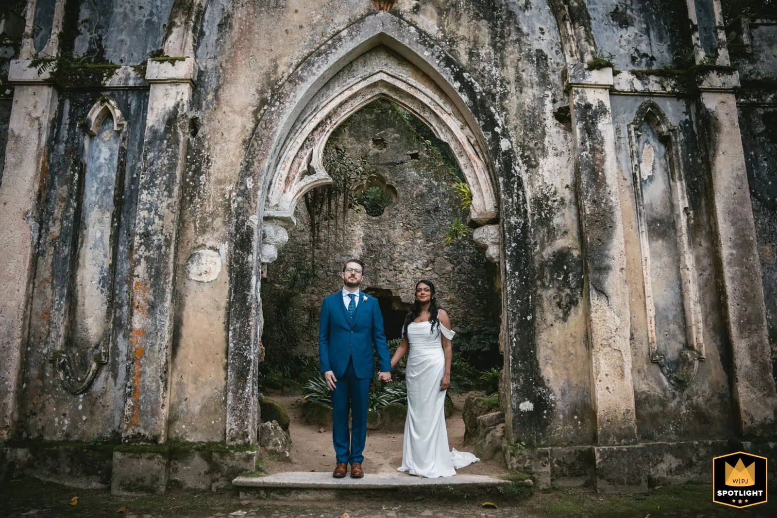 Romantic Italy elopement with couple in historic ruins backdrop.