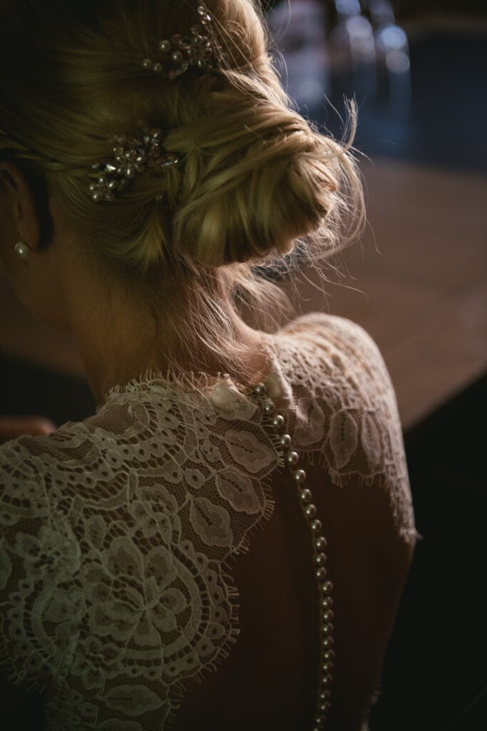Detail of the back of a bride on her elopement day in Central France