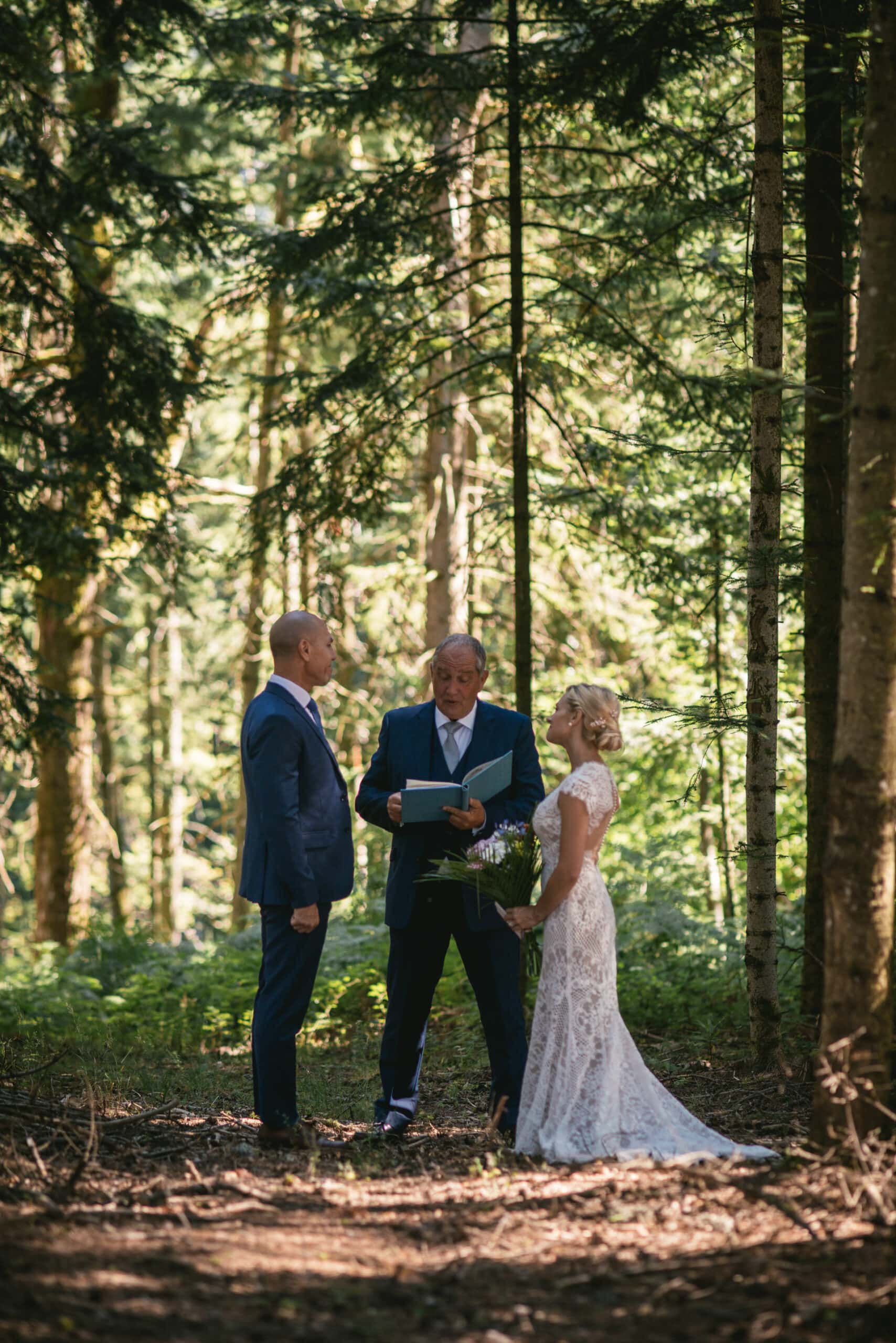 Bride and groom exchanging their vows in a forest in Central France