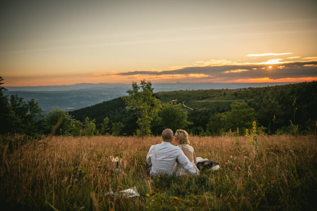 Bride and groom enjoying the sunset after their elopement in Central France