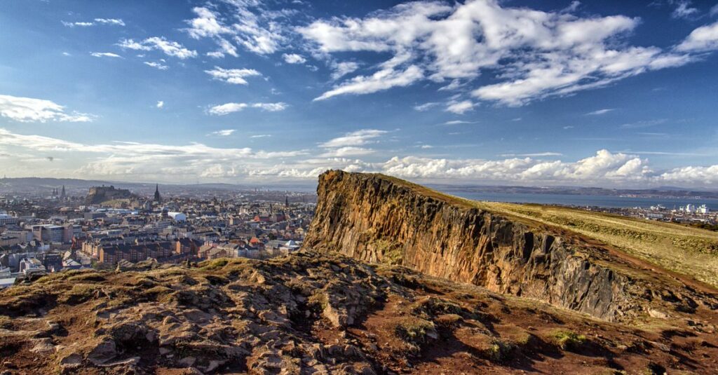 A rocky cliff overlooking Edinburgh , one of the best places to elope in Edinburgh, Scotland
