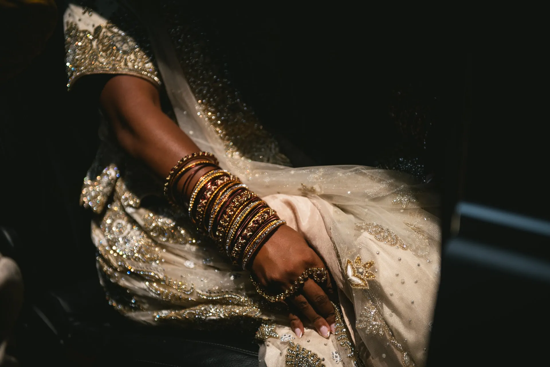 Couple in their traditional Sikh wedding outfits posing in the streets of Positano during their elopement on the Amalfi Coast