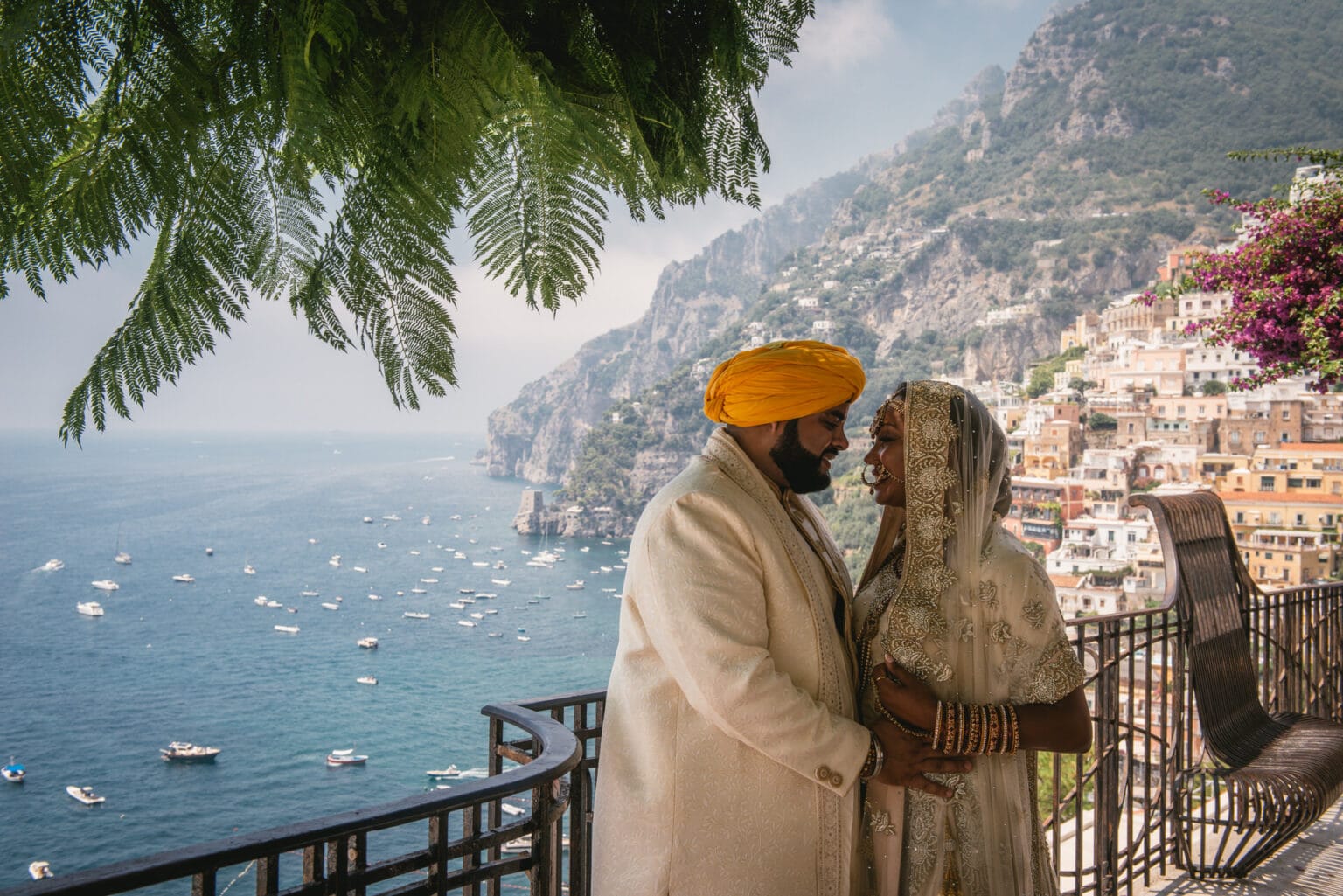 Couple in their traditional Sikh wedding outfits posing in the streets of Positano during their elopement on the Amalfi Coast