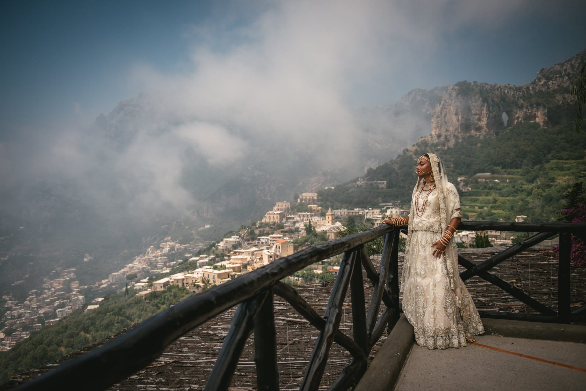 Bride in her Sikh wedding attire with Positano in the background on his elopement day