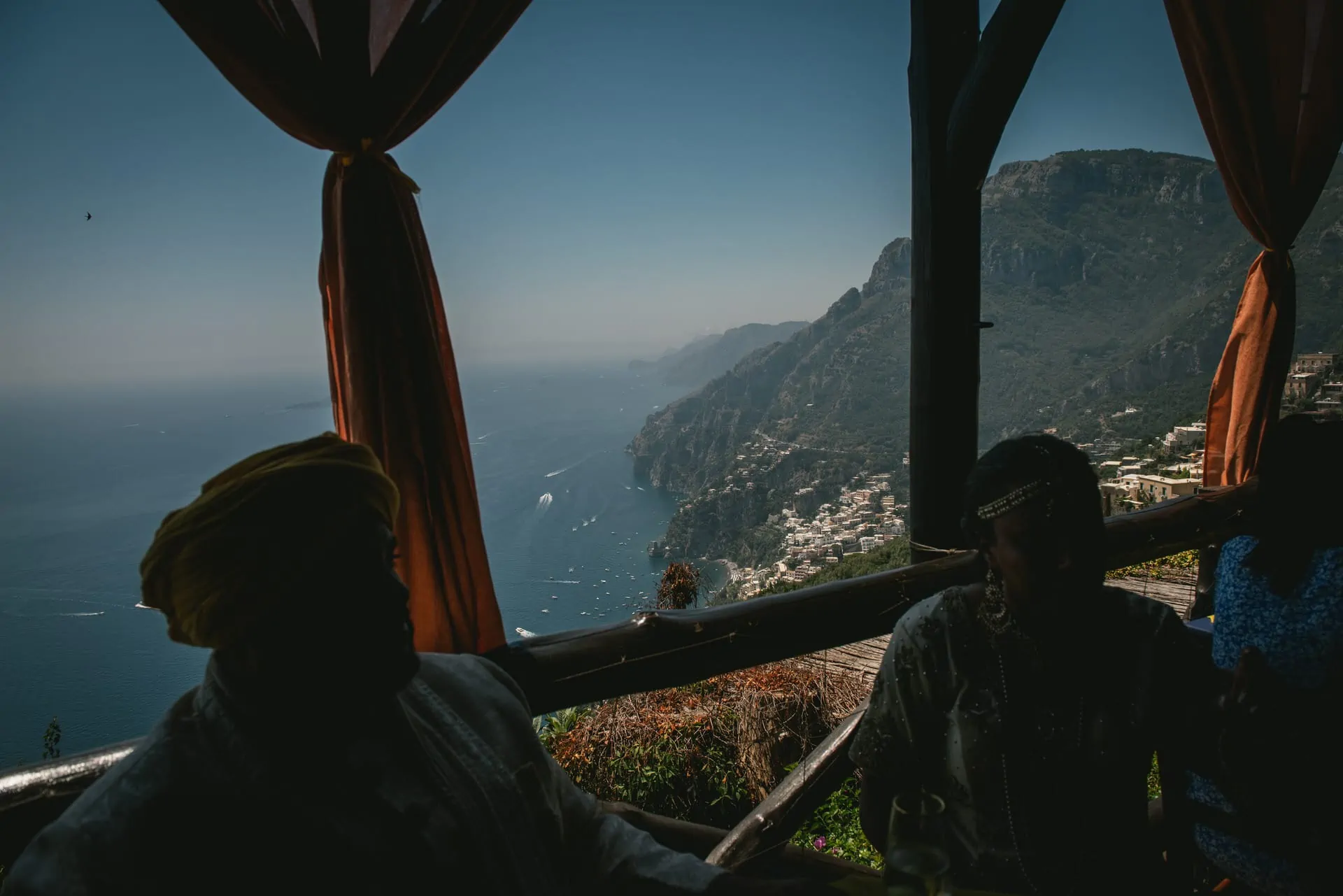 Bride and groom in their Sikh wedding attire having a delicious meal in Positano