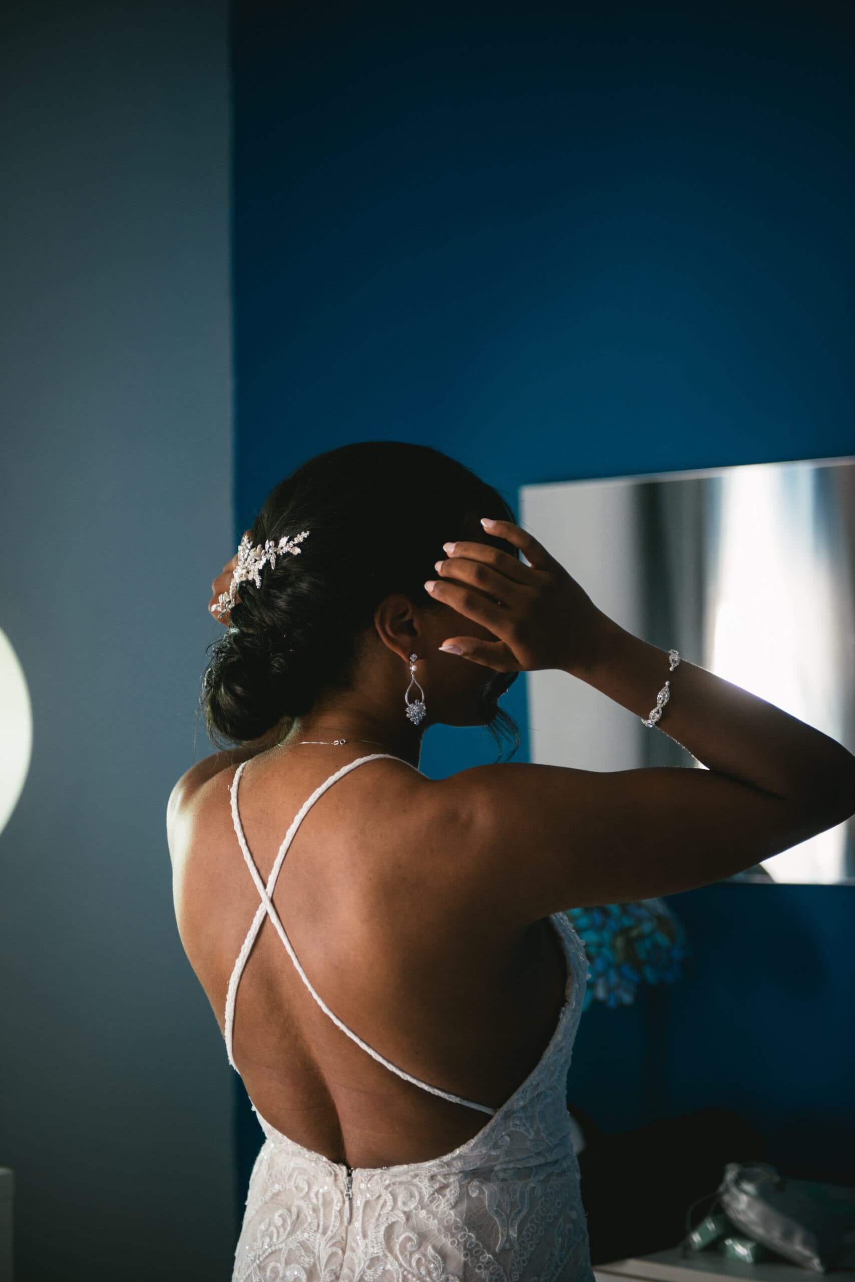 Bride fixing her hair before her elopement ceremony in Positano