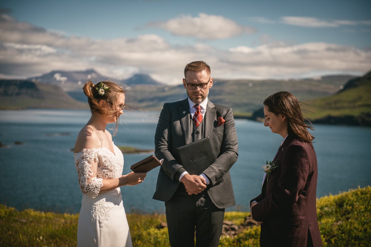Same-sex elopement ceremony in an Icelandic bay