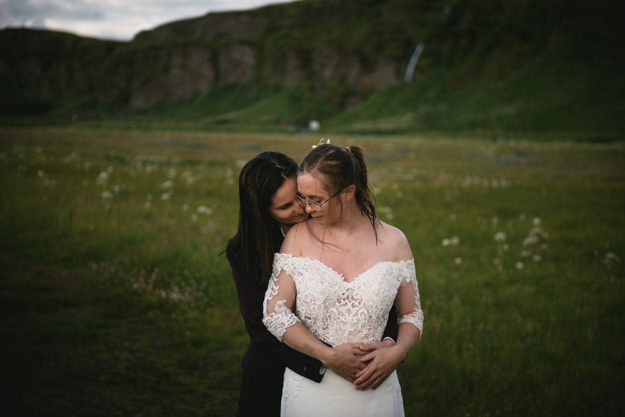 Couple posing in front of Seljadandsfoss during their elopement in Iceland