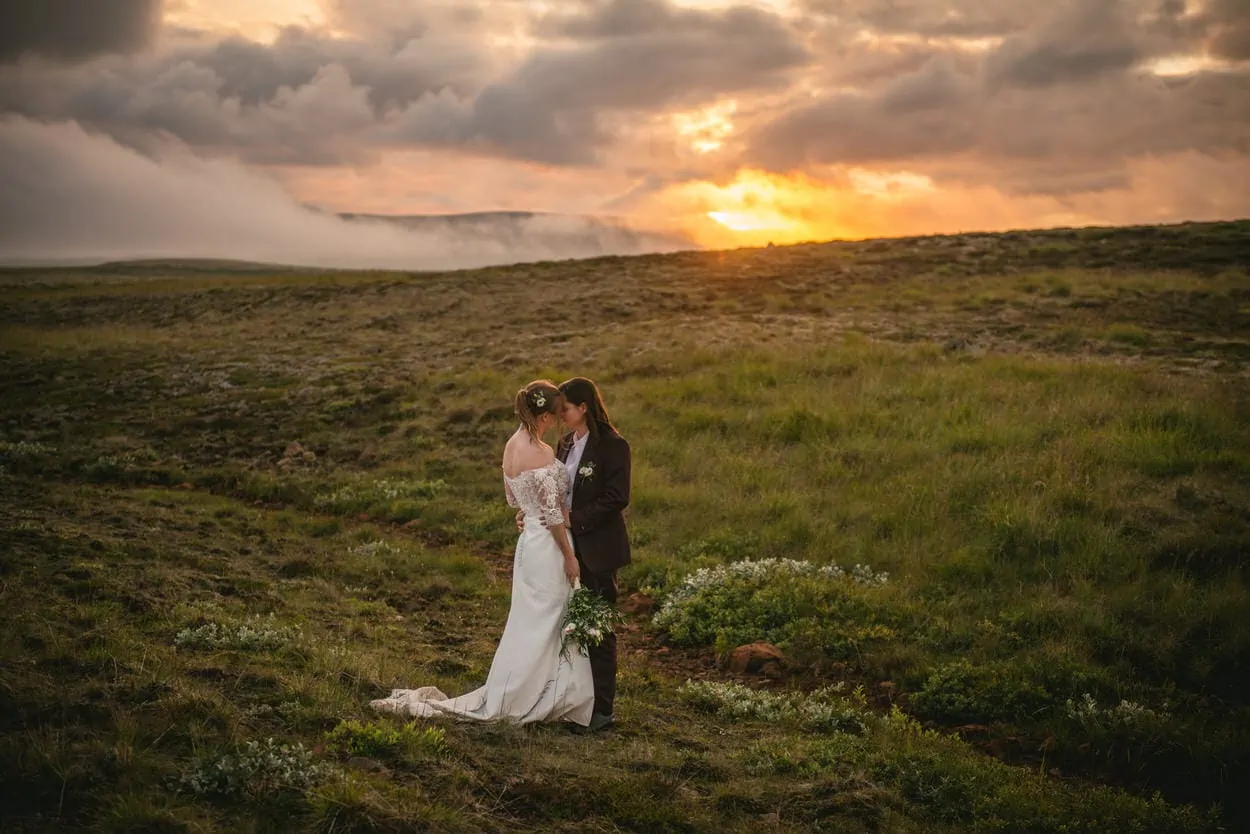 Sunset elopement photos in Iceland with a same-sex couple