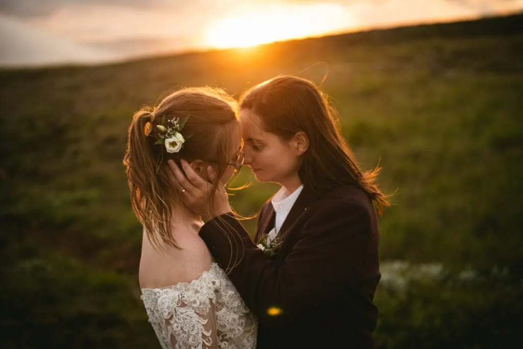 Sunset elopement photos in Iceland with a same-sex couple