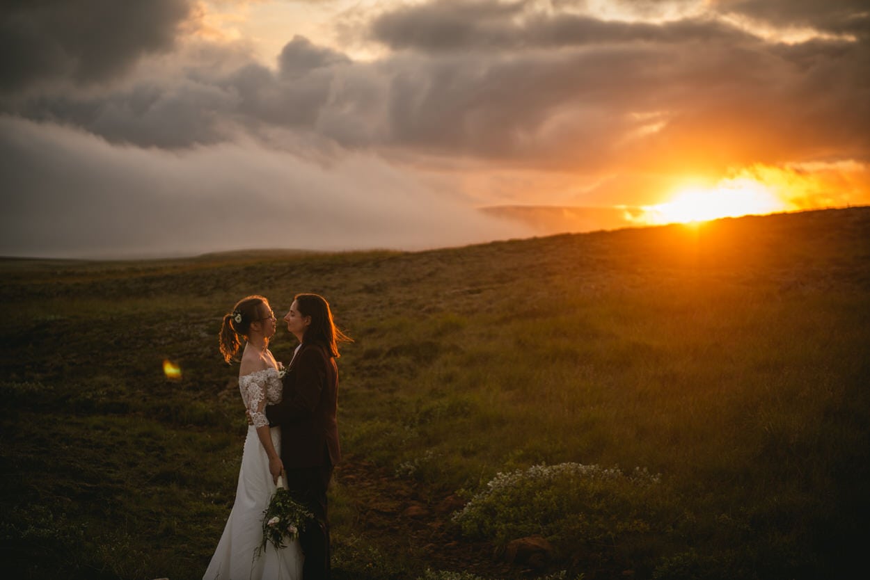 Sunset elopement photos in Iceland with a same-sex couple