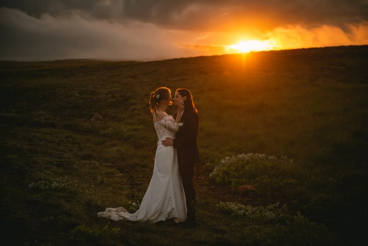 Sunset elopement photos in Iceland with a same-sex couple