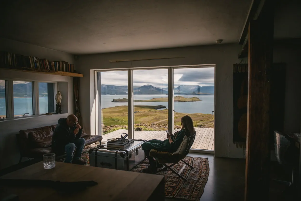 Guests waiting by the window for the couple to get ready before their elopement ceremony
