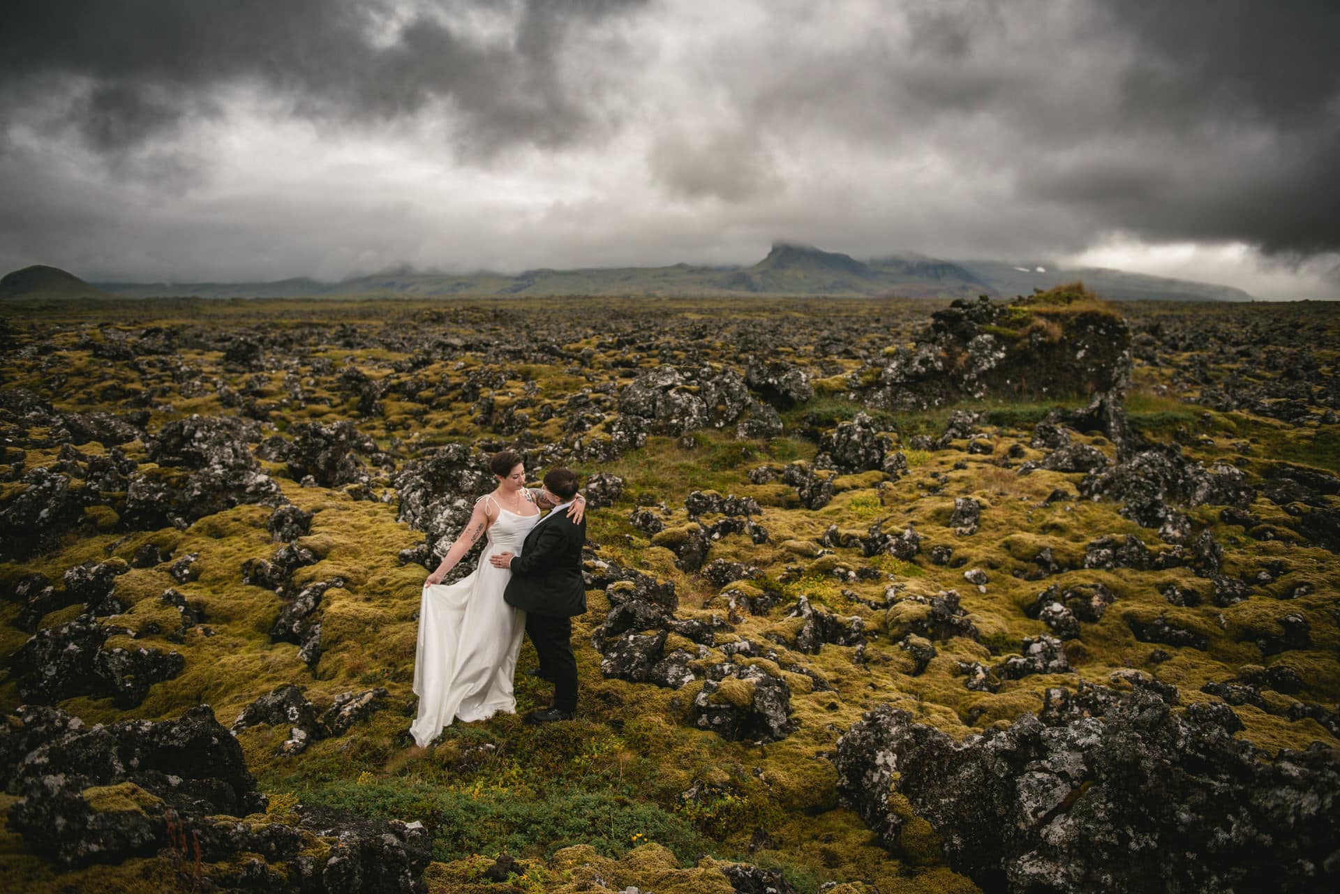 Couple enjoying the beauty of a lava field on their elopement day