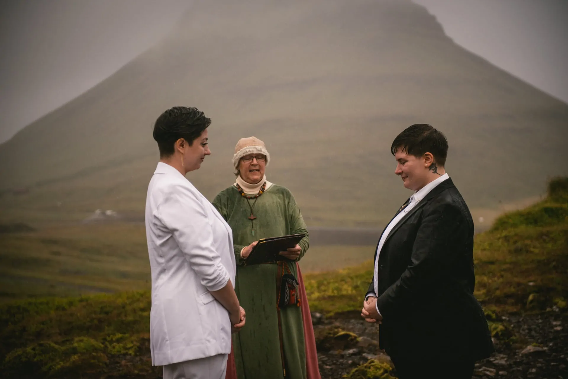 Same-sex couple exchanging their vows during their Pagan wedding ceremony in Iceland