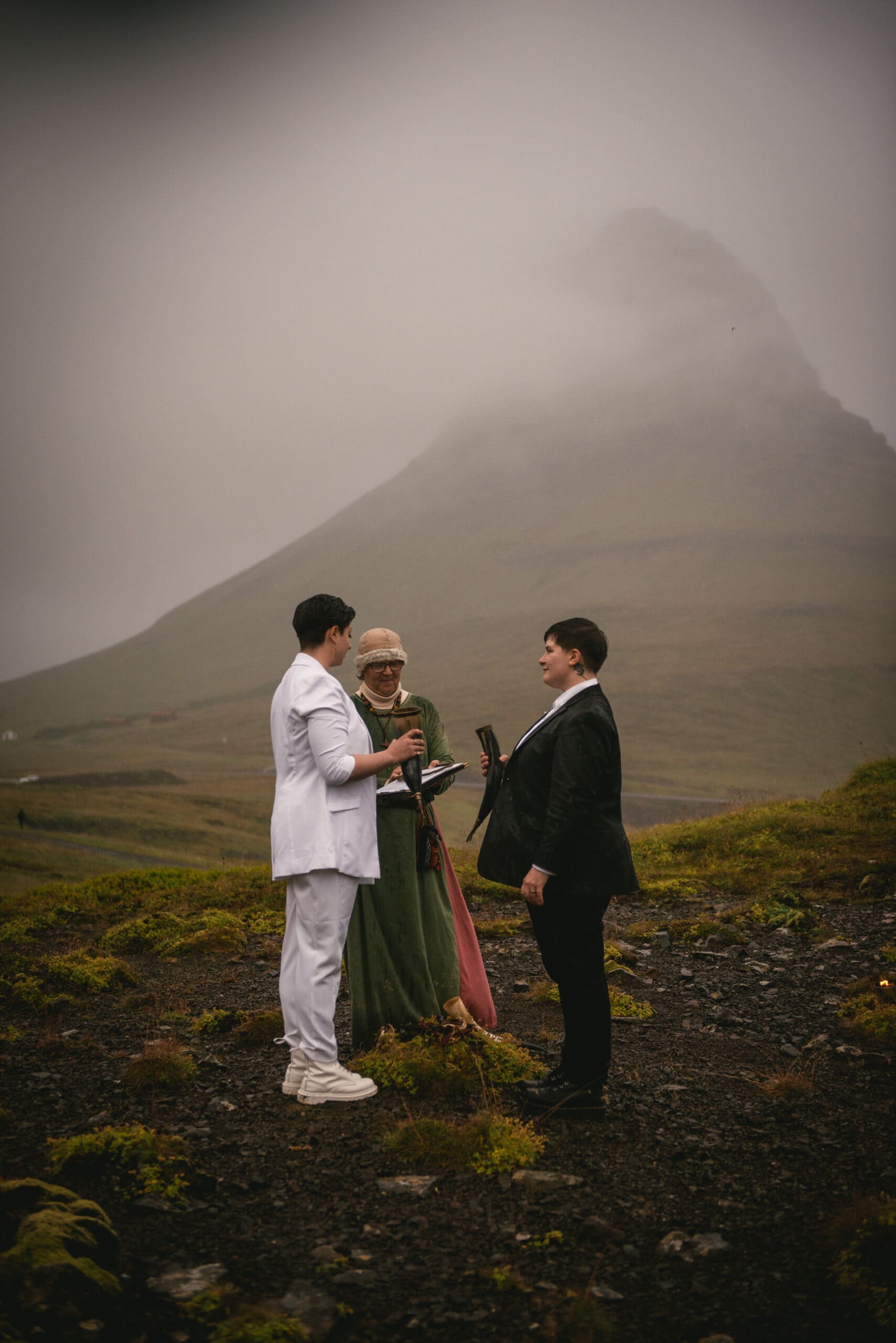 Same-sex couple exchanging rings during their Pagan wedding ceremony in Iceland