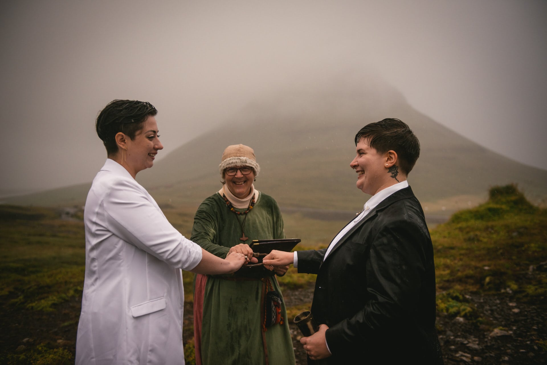 Brides looking at each other during their Pagan wedding ceremony in Iceland