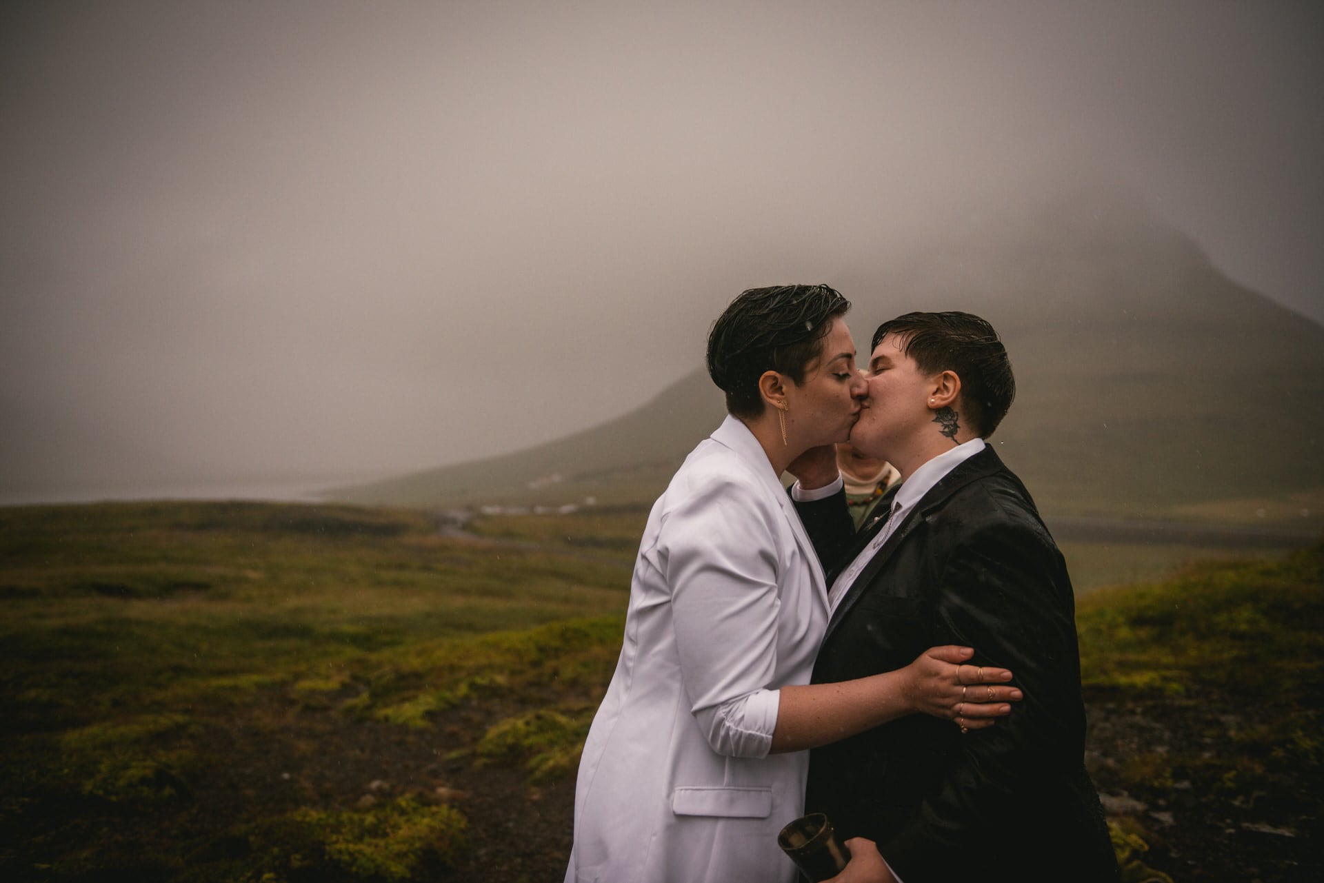 First kiss of two brides during their Pagan wedding ceremony in Iceland