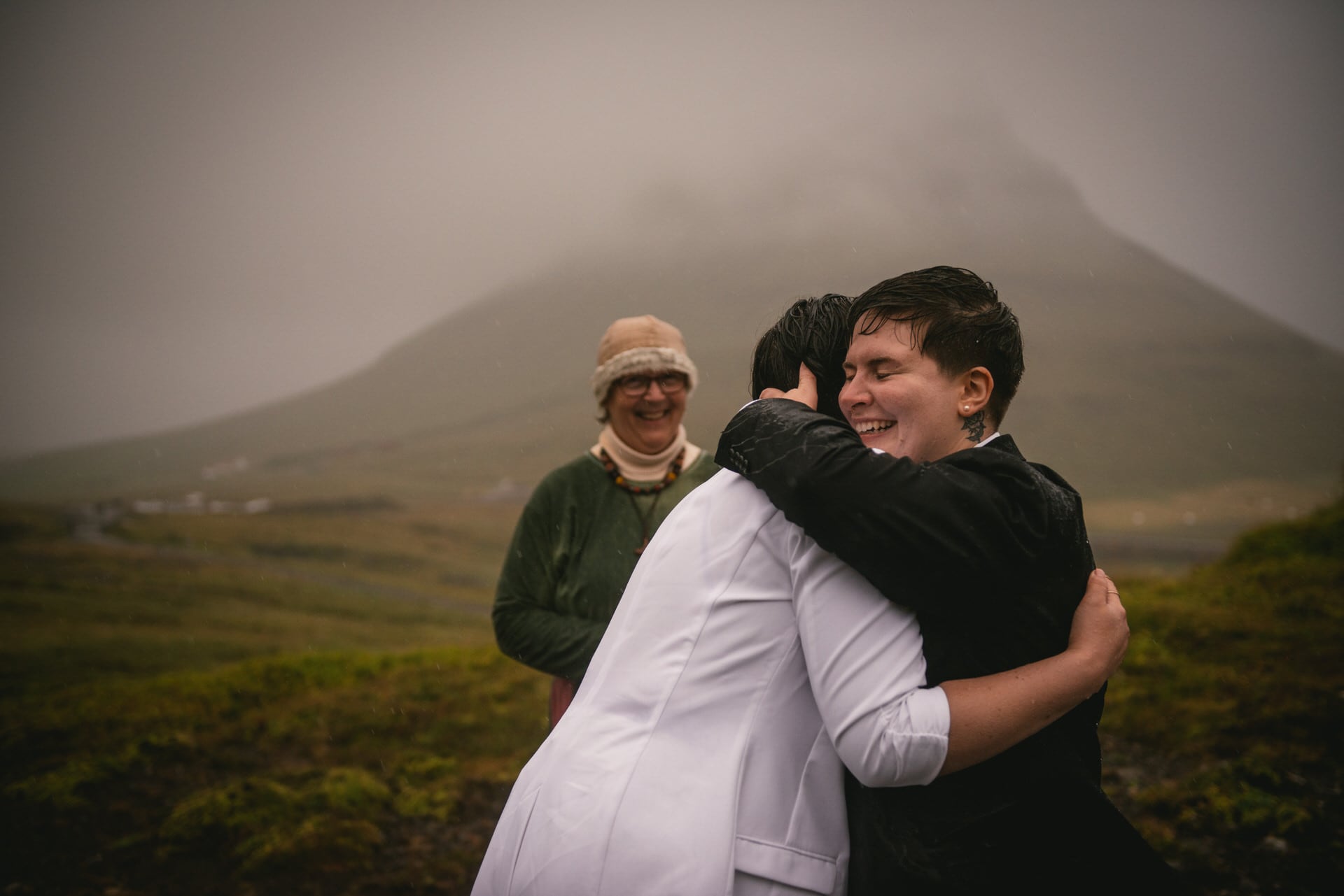 Brides hugging and crying of joy after their Pagan wedding ceremony in Iceland