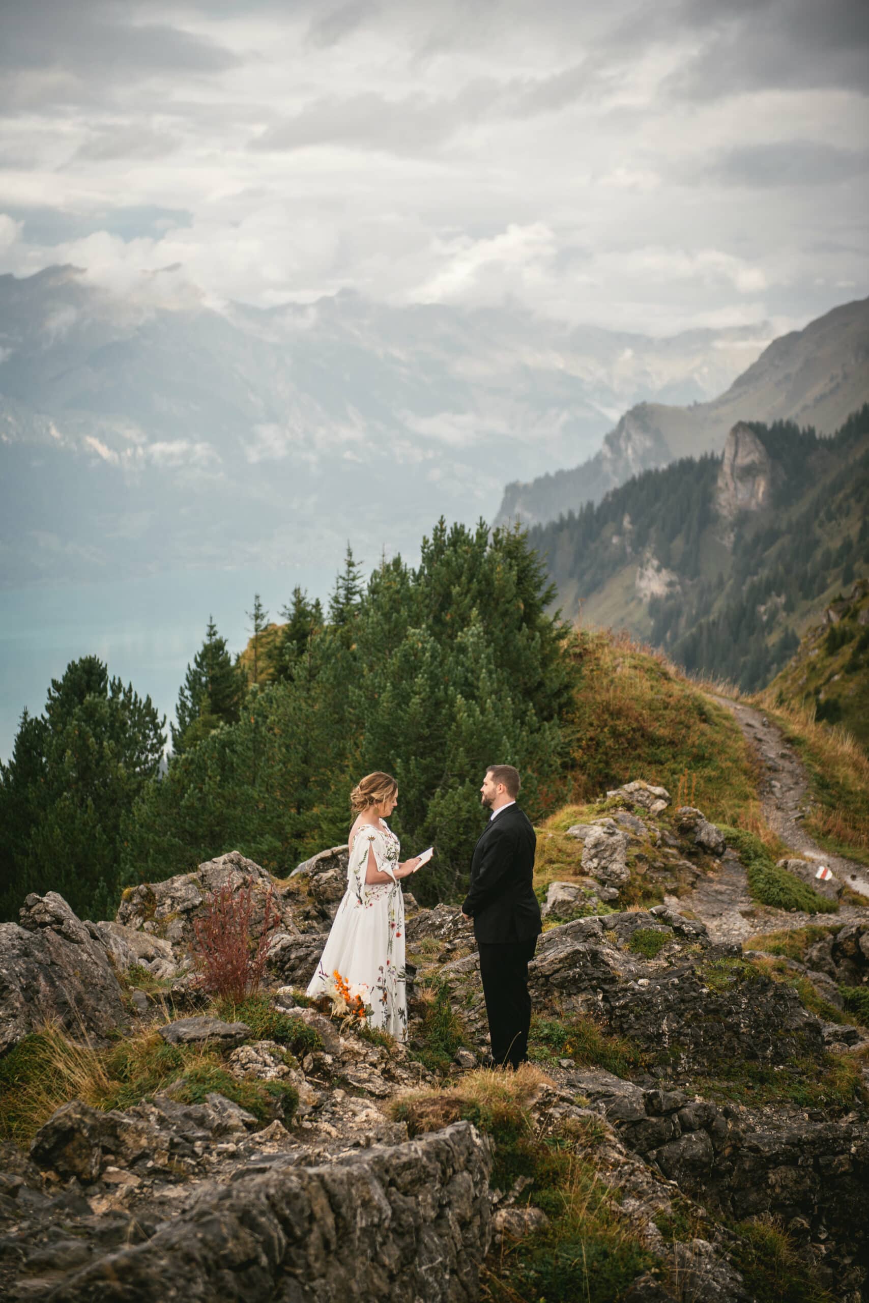Couple exchanging their vows at Schynigge Platte during their elopement in Switzerland