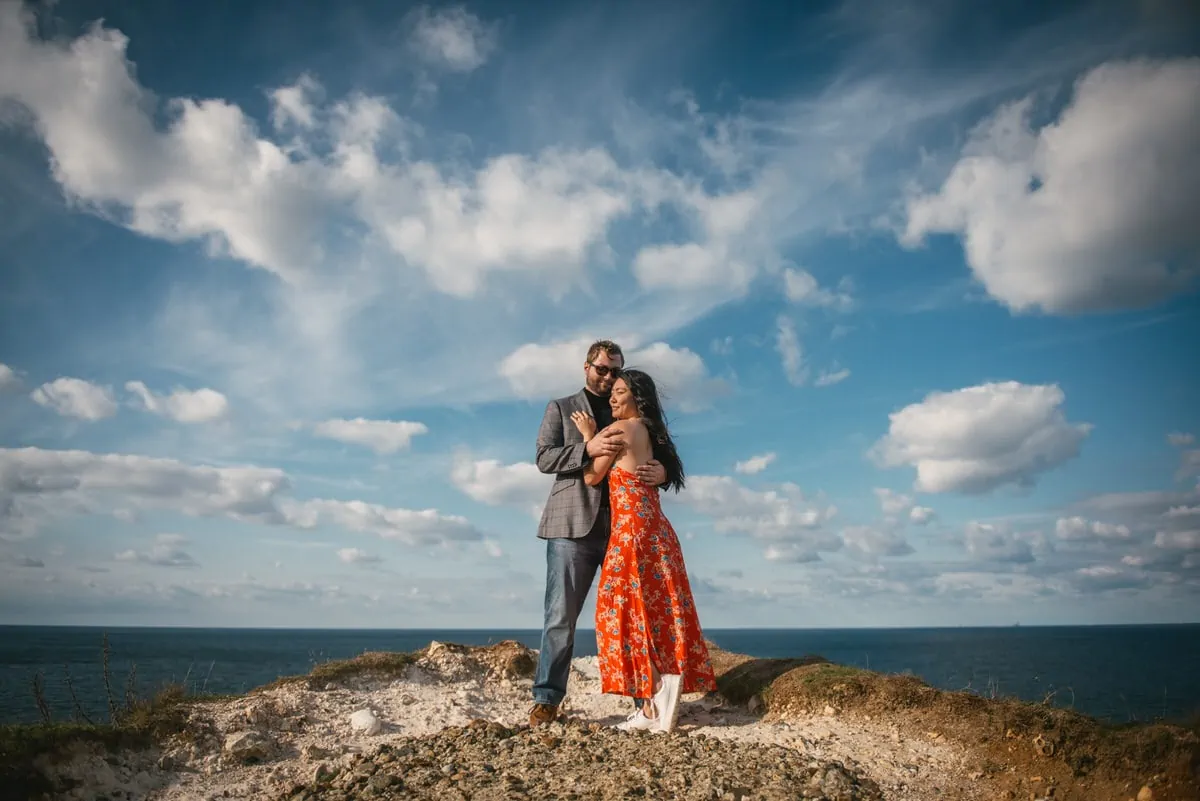 Couple posing on top of the Etretat cliffs before their elopement in Normandy