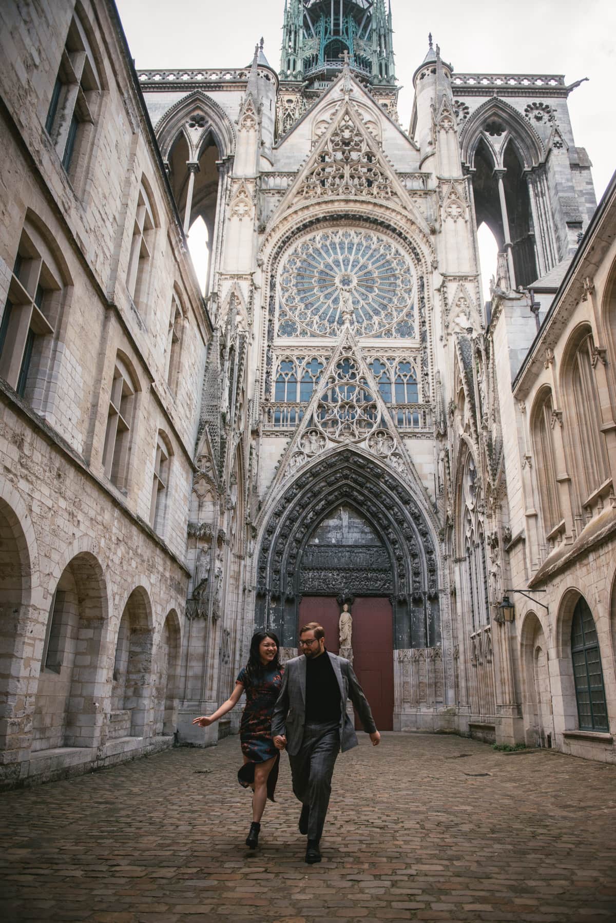 Couple by the Rouen cathedral before their elopement in Normandy
