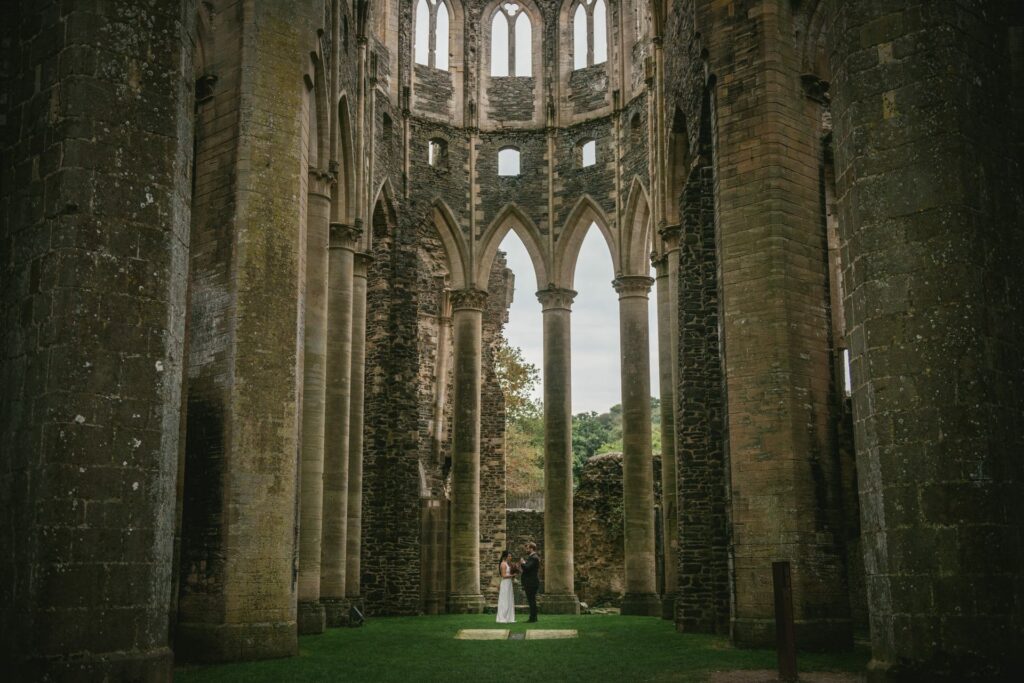 Couple eloping in Normandy at the Abbaye d'Hambye ruined chapel