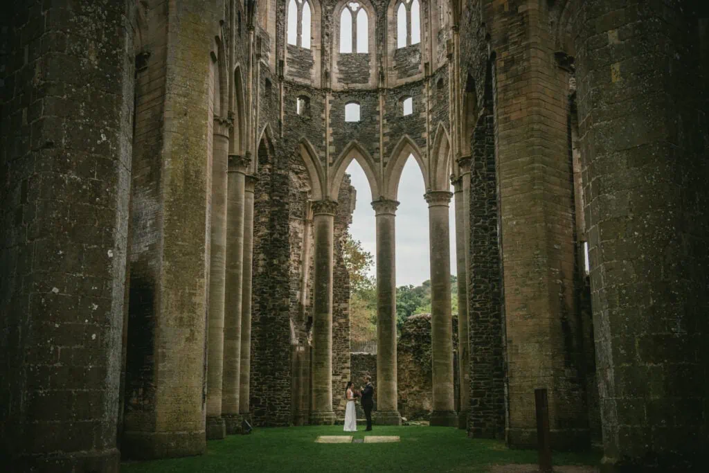 Couple eloping in Normandy at the Abbaye d'Hambye ruined chapel
