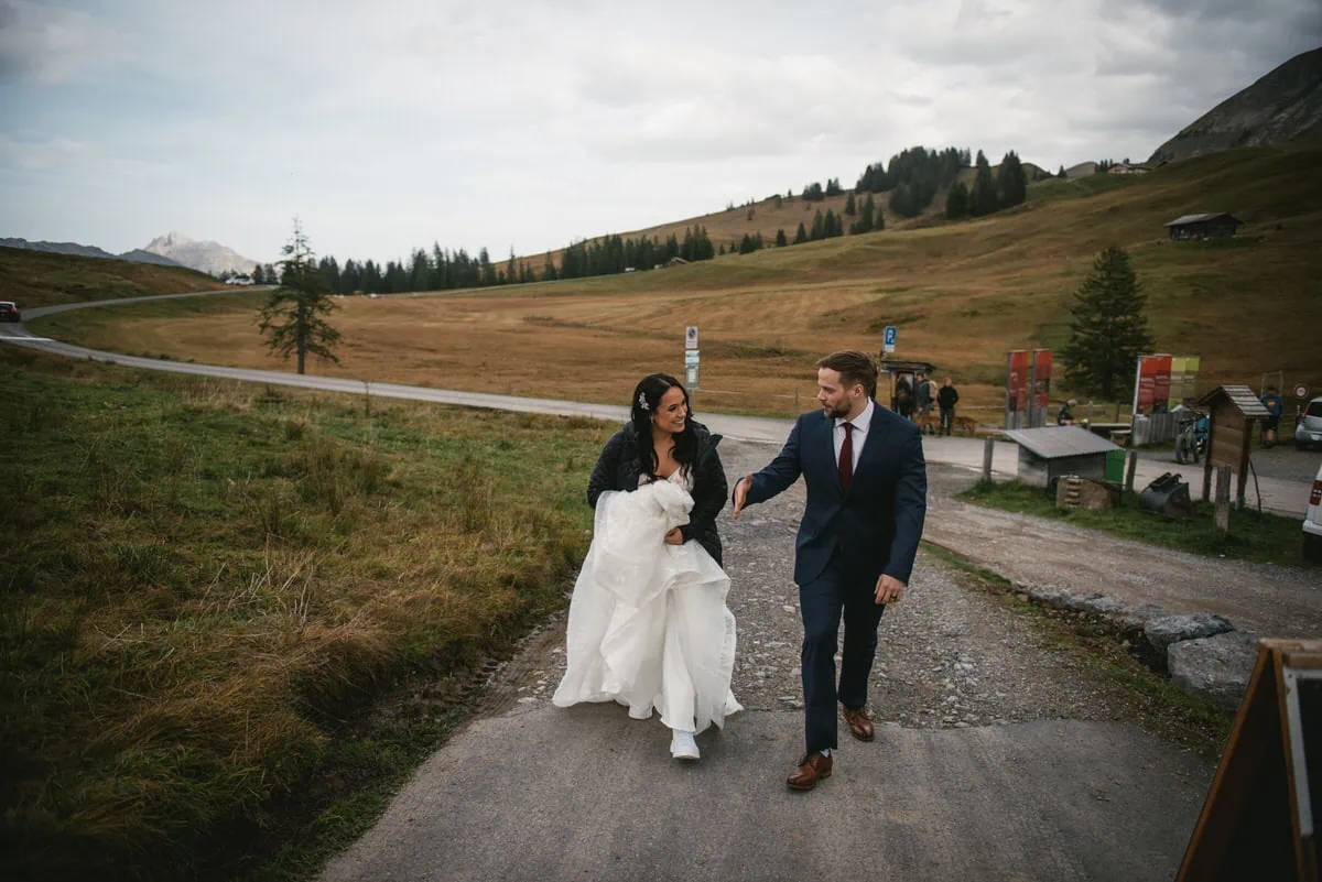 Couple on their elopement day in the Interlaken region of Switzerland - eating lunch at an altitude restaurant