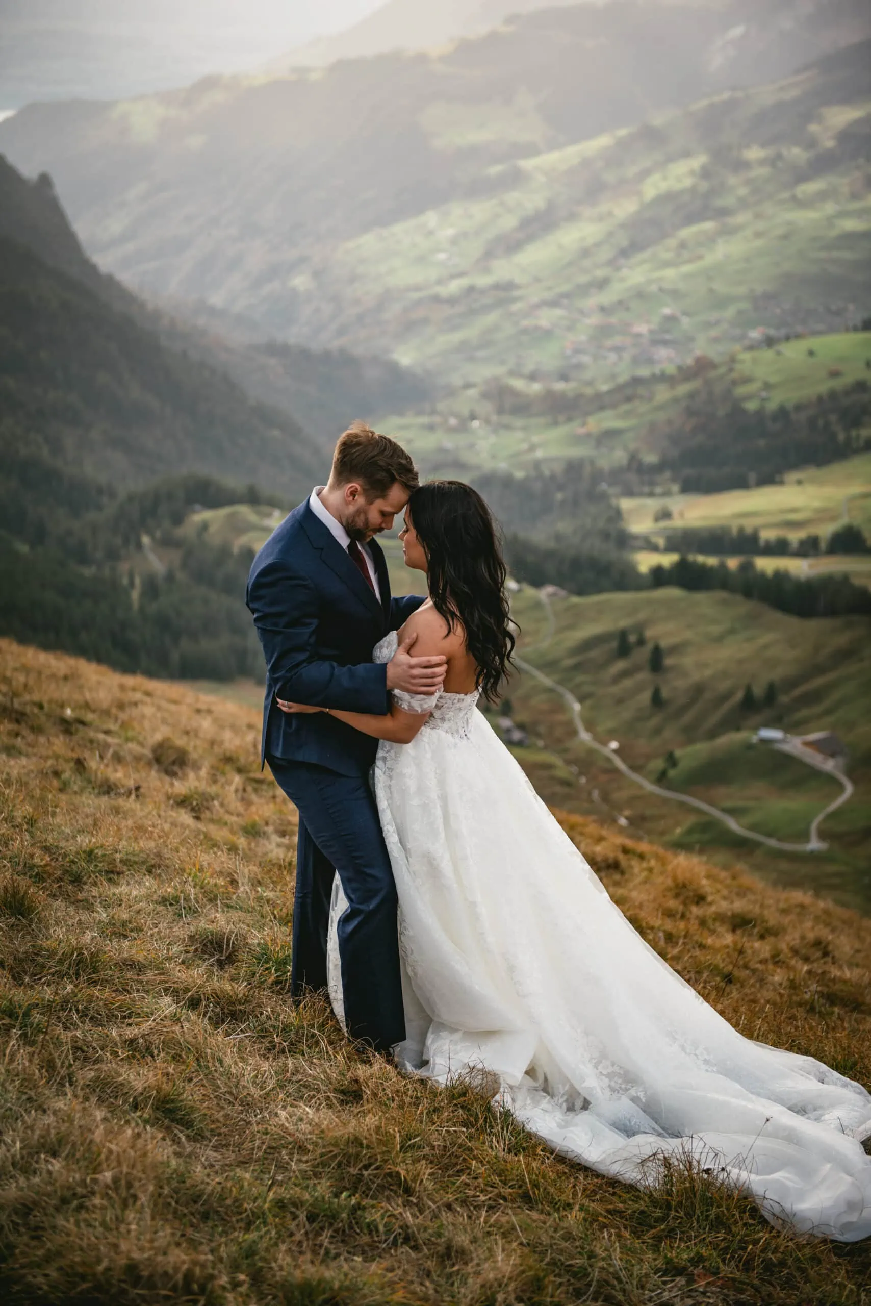 Couple on their elopement day in the Interlaken region of Switzerland - couple hiking to their ceremony spot