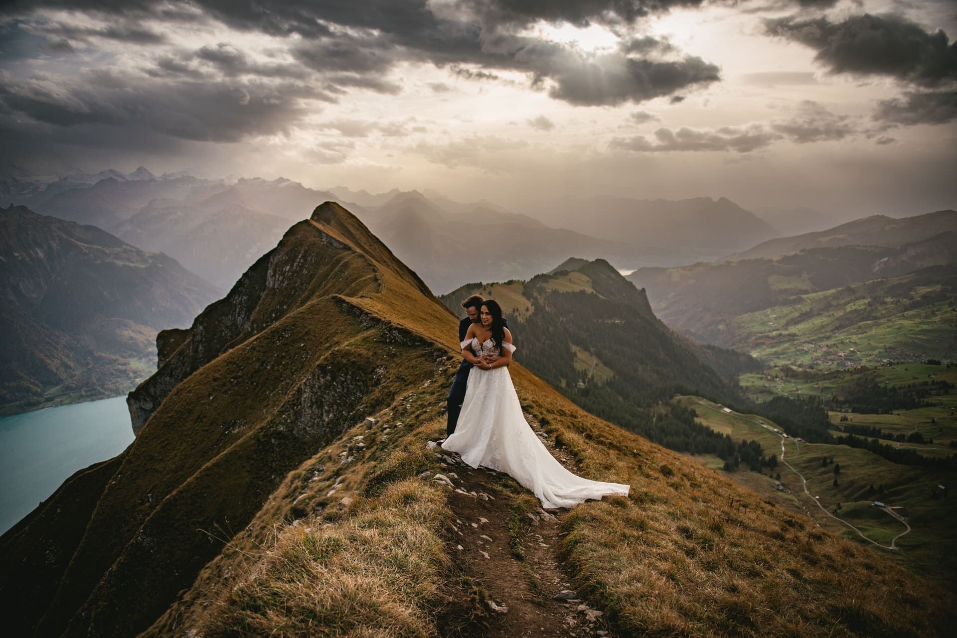 Couple on their elopement day in the Interlaken region of Switzerland - couple hiking to their ceremony spot