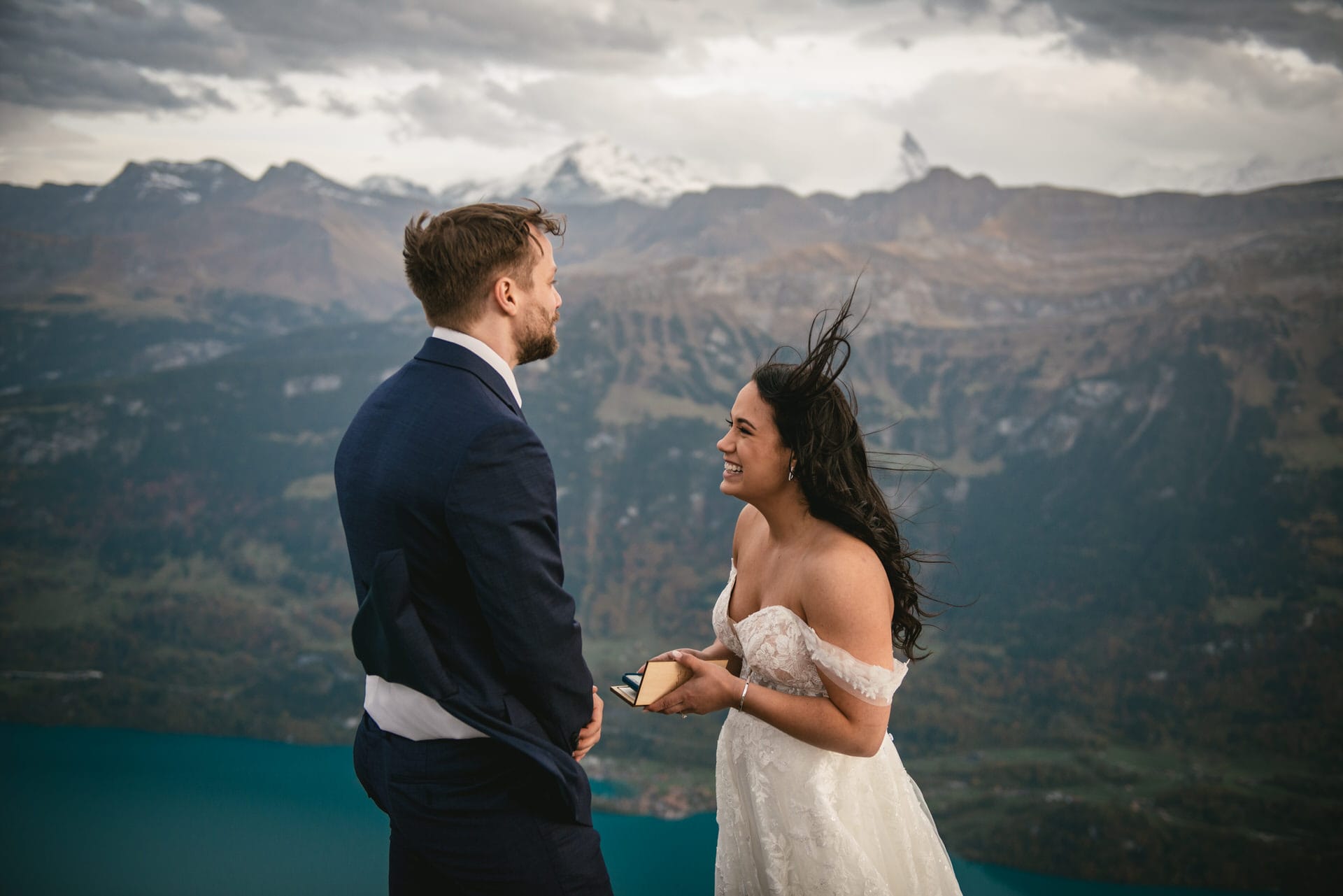 Couple on their elopement day in the Interlaken region of Switzerland - ceremony overlooking the Brienz lake