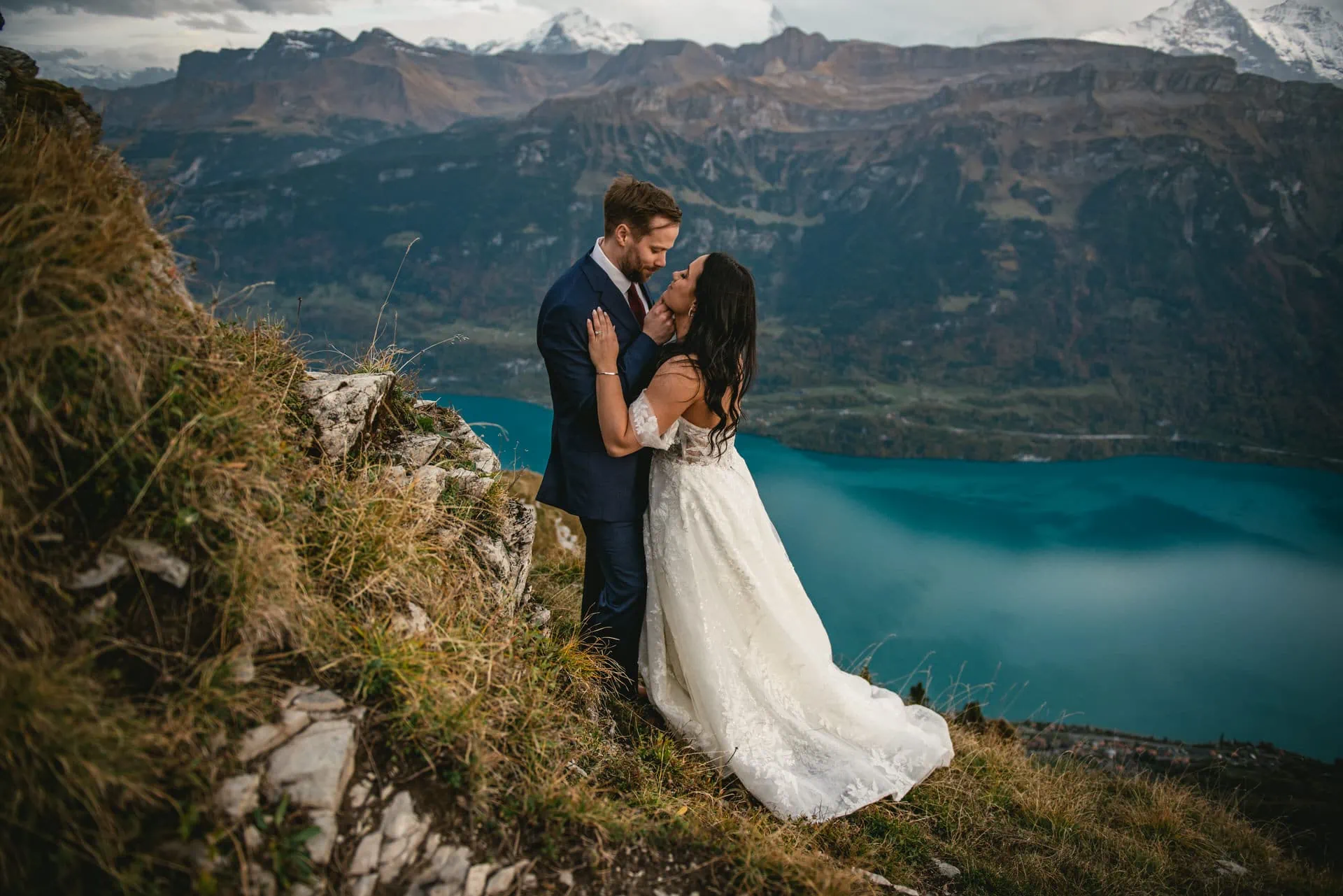 Couple on their elopement day in the Interlaken region of Switzerland - sunset photoshoot on top of the mountain