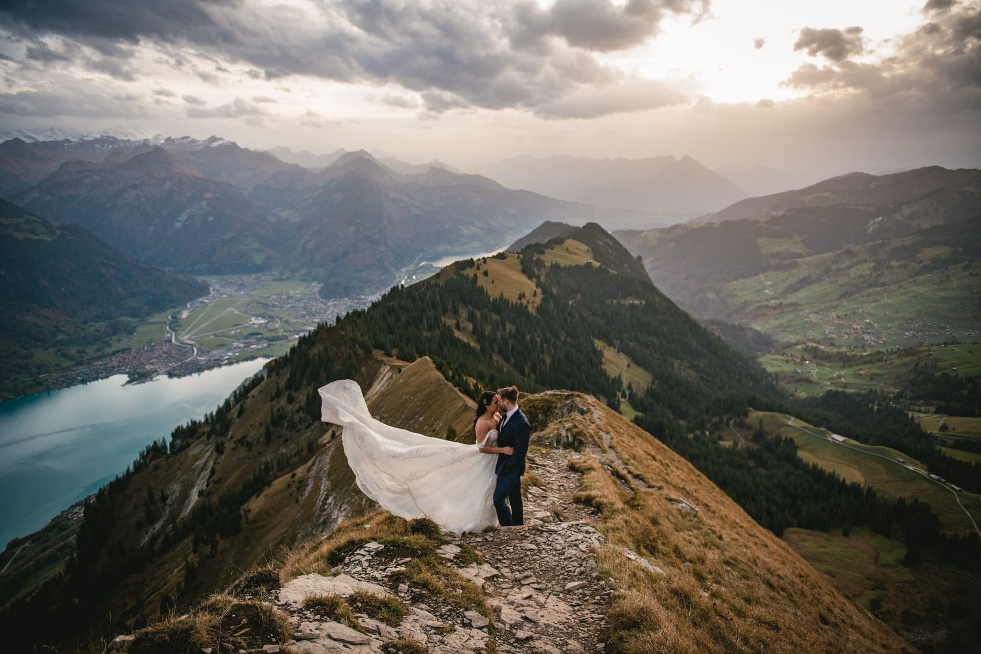 Couple on their elopement day in the Interlaken region of Switzerland - sunset photoshoot on top of the mountain
