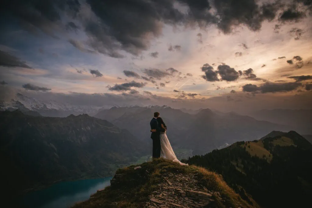 Couple on their elopement day in the Interlaken region of Switzerland - sunset photoshoot on top of the mountain