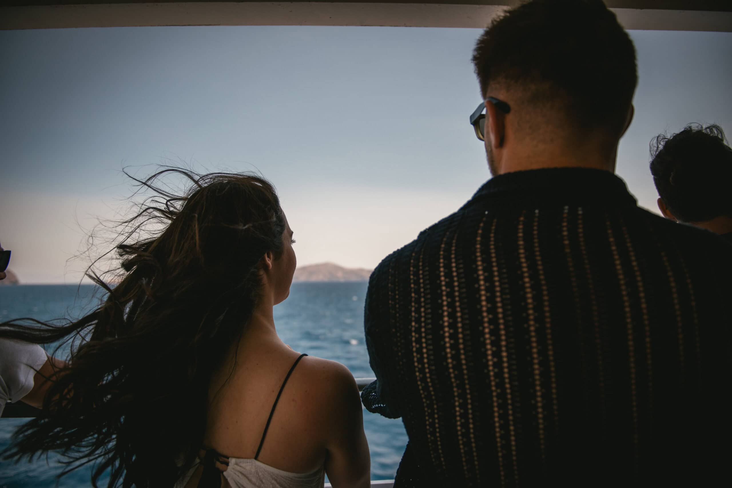 Sailing Between Islands, a Greece elopement moment by Zephyr and Luna