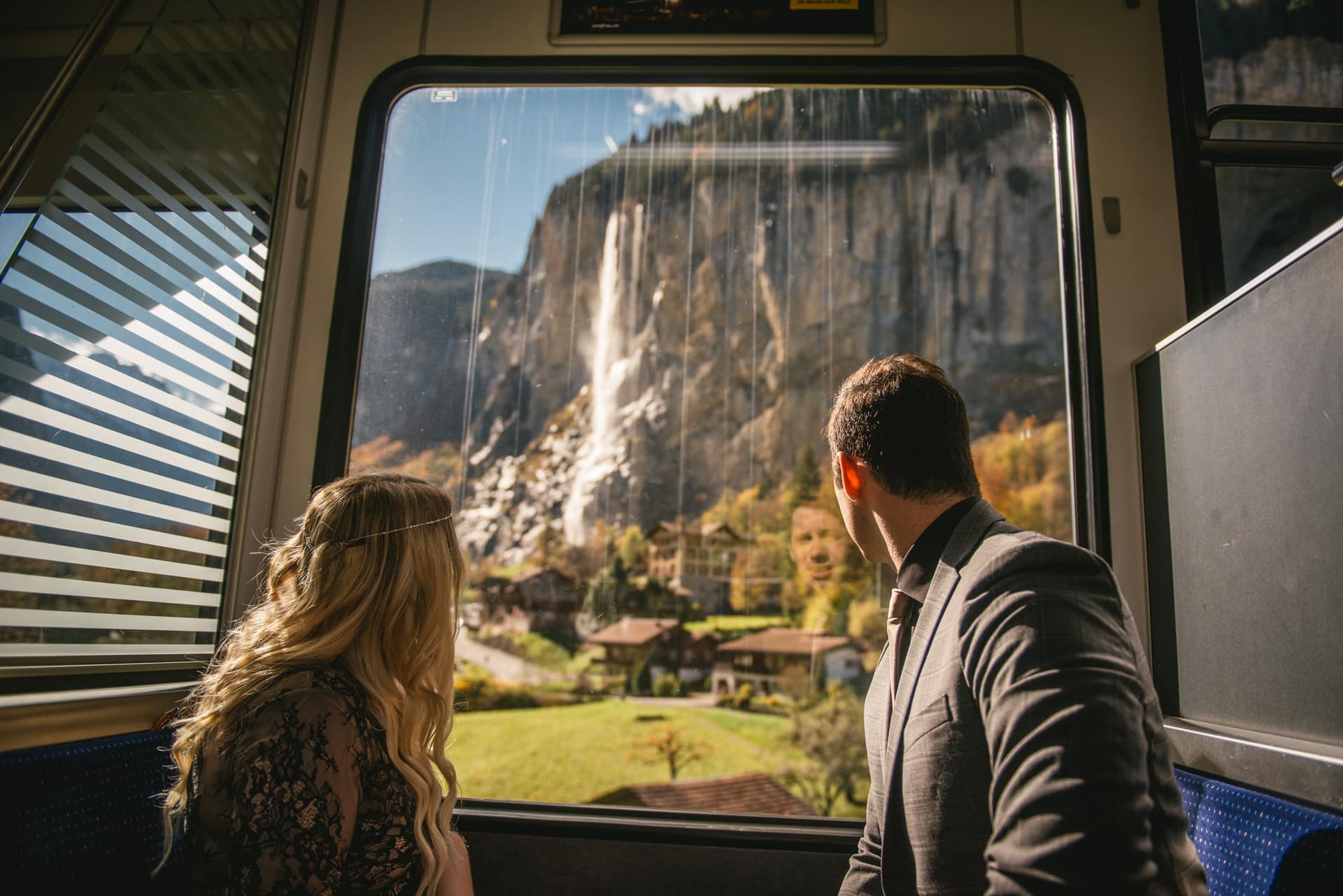 Couple holding hands in the train down from Wengen to Lauterbrunnen