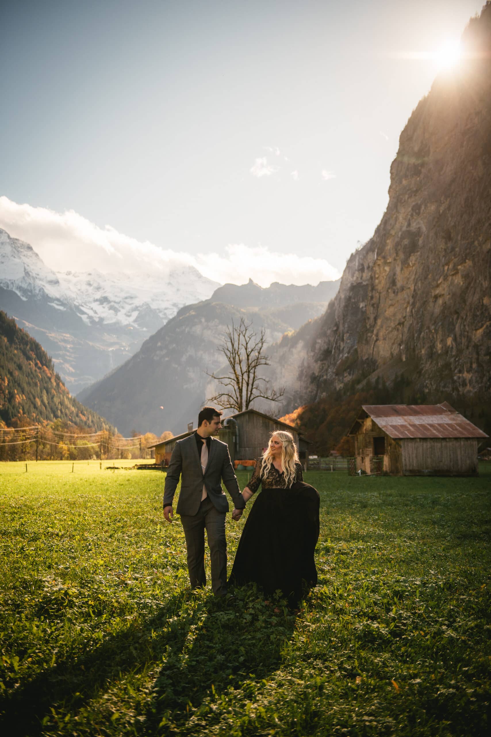 Couple walking in the Lauterbrunnen valley on their elopement day in Switzerland