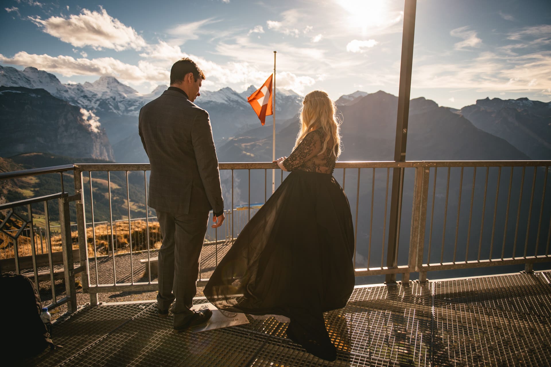 Couple looking at the view from the Mannlichen on their elopement day in Switzerland