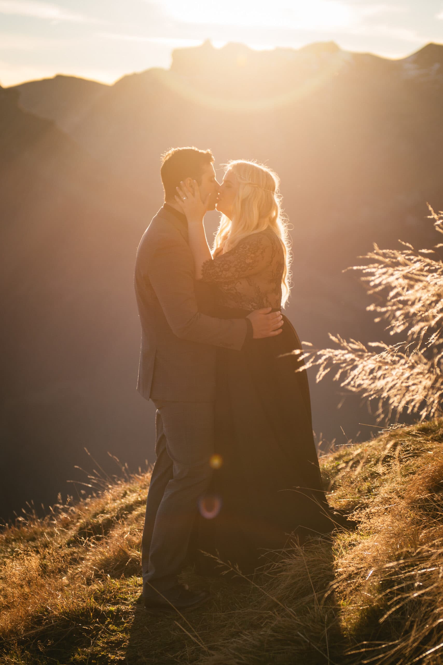 Couple kissing at sunset on their elopement day in Switzerland