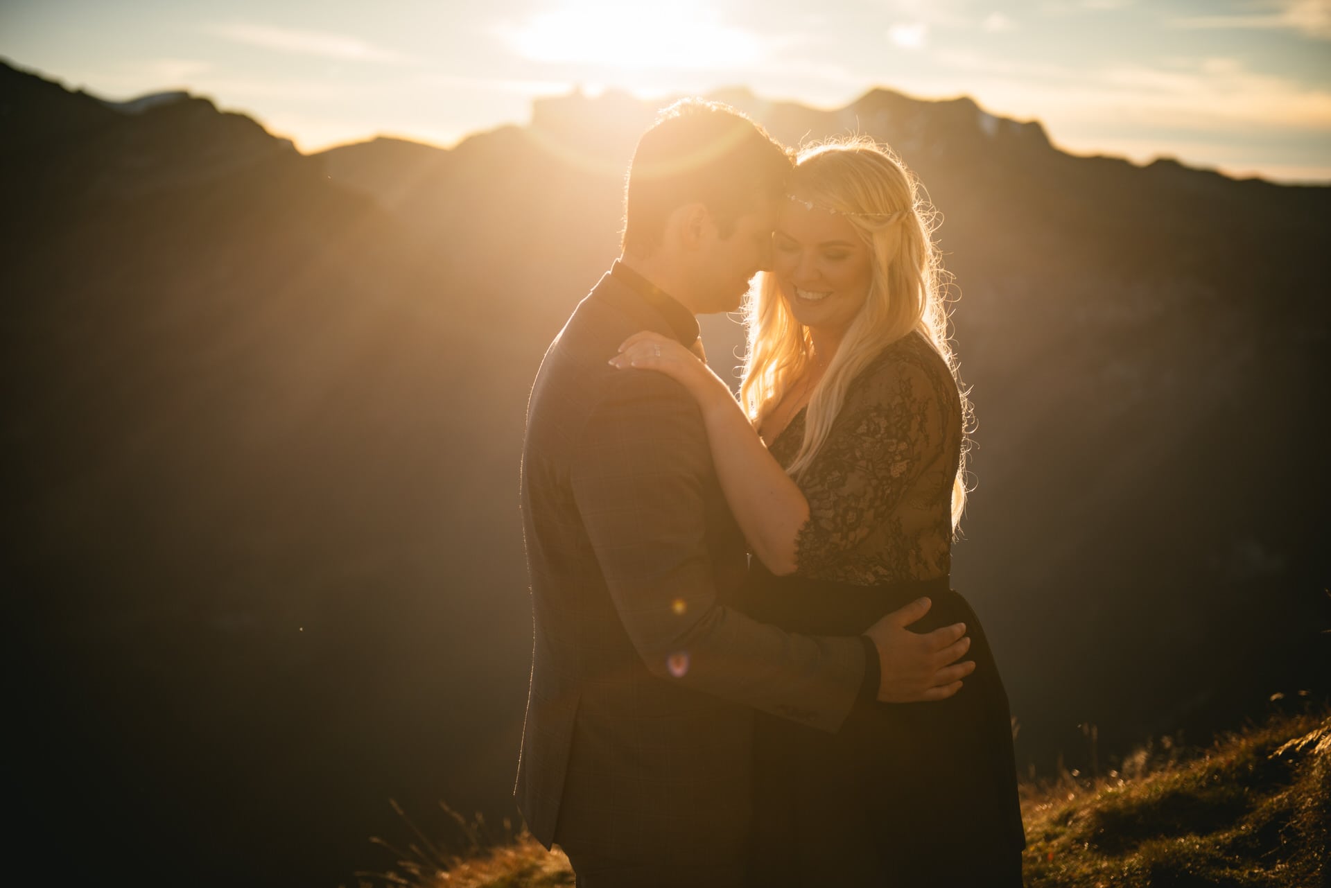 Couple hugging at sunset on their elopement day in Switzerland