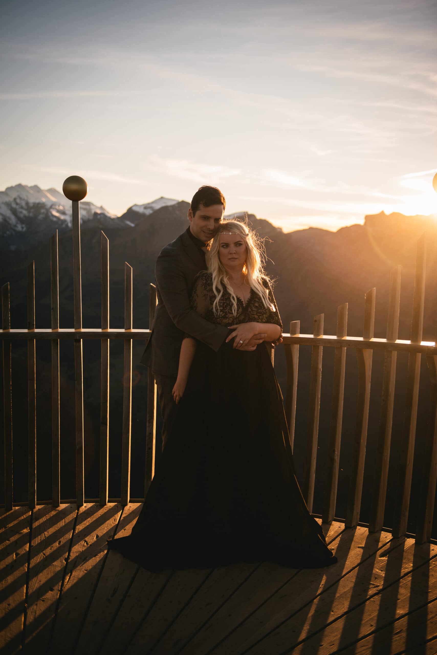 Couple on top of the Mannlichen at sunset on their elopement day in Switzerland