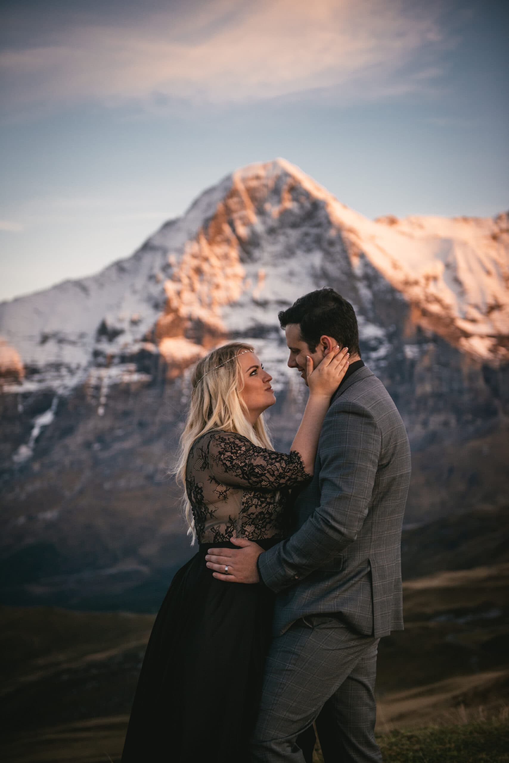 Couple enjoying the alpenglow in the Lauterbrunnen valley at sunset on their elopement day in Switzerland