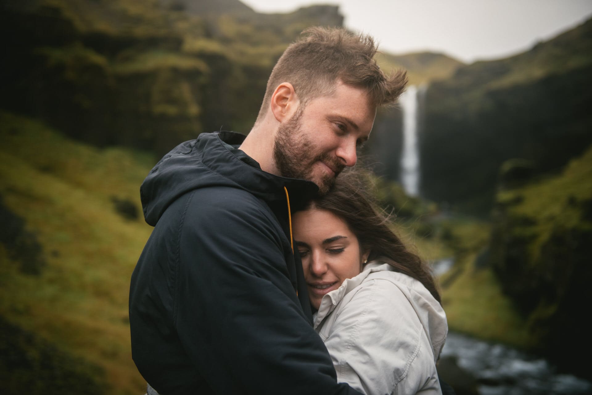 Couple hugging in a valley before their elopement in Iceland