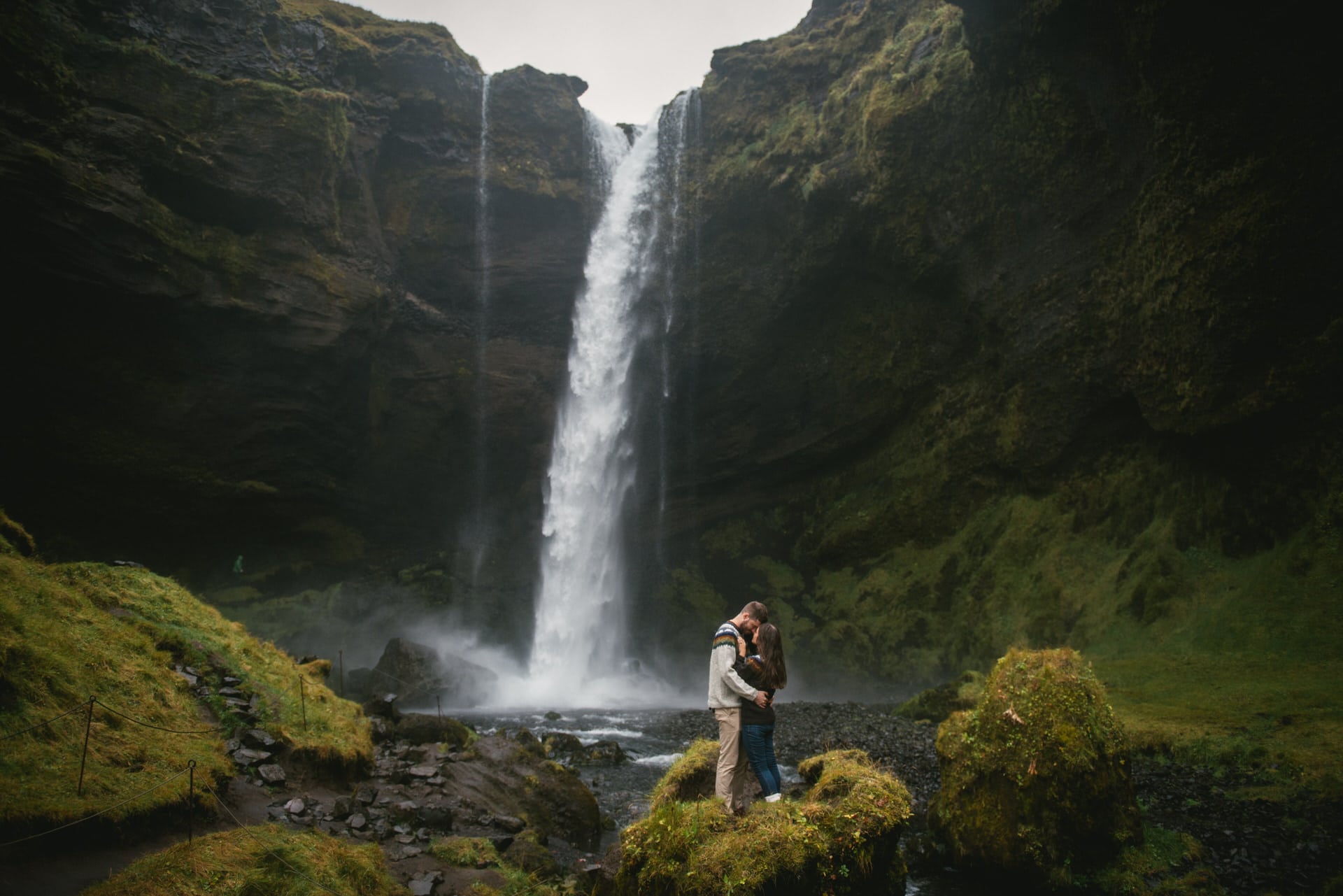 Couple kissing at Kvernufoss before their elopement in Iceland