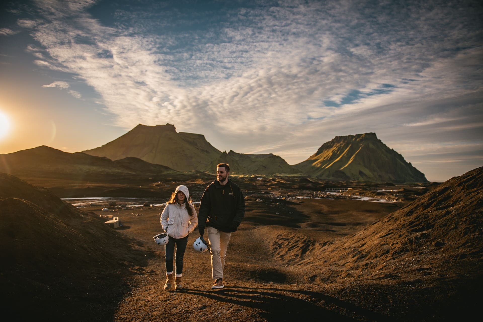 Couple walking in the Katla delta after their elopement in Iceland