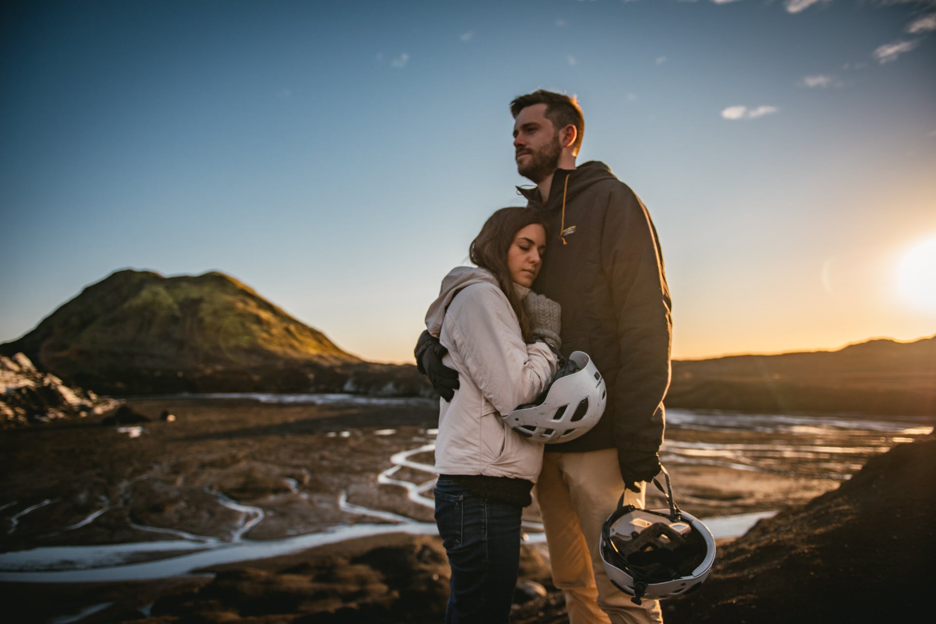 Couple hugging in the Katla delta after their elopement in Iceland